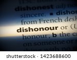 Small photo of dishonour word in a dictionary. dishonour concept.