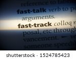 Small photo of fast-track word in a dictionary. fast-track concept, definition.