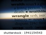 Small photo of wrangle word in a dictionary. wrangle concept, definition.