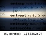 Small photo of entreat word in a dictionary. entreat concept, definition.