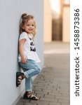 Small photo of Little girl deride. Beautiful blond hair female child