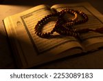Small photo of Concept: open Quran book local language holy prayers for god,Coran - holy book of Muslims religion, Friday month of 1444 Puasa Ramadan religion Islamic worshiping faith Koran ,Thailand- 12.1.2023
