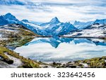 Swiss alps water reflection in  Bachalpsee - mountain lake above Grindelwald, Switzerland.