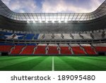 Digitally generated chile national flag against large football stadium