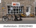 Small photo of Hugh Town, St Marys, Scilly Islaes, UK. 10 June 2023. Bike and scooter hire shop with an outdoor display in town centre of Hugh Town
