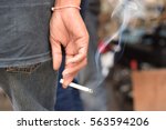 Image of cigarette in man hand...