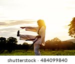Woman Training Taekwondo Sunset....