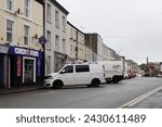 Small photo of 20th February 2024- A white Volkswagen Transporter T28 Startline Tdi, panel van, parked on the main street in the the town center at Carmarthen, Carmarthenshire, Wales, UK.