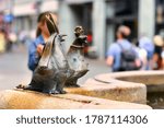 Small photo of Konstanz, Germany - July 2020: Part of fountain called 'Kaiserbrunnen' with satiric sculpture of a pigeon wearing a bishop's mitre, representing religious and worldly power