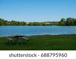 Small photo of Title: Bench in front of Wampum Lake Description: Taken at Wampum Lake, A bench sits in front of the lake.