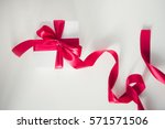 white gift box with red ribbon | Shutterstock . vector #571571506
