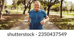Small photo of Senior man running in a park with a smile on his face and earphones on. Elderly man embracing physical fitness, caring for his health and wellbeing and longevity in his golden years.