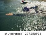 Athletes swimming in a competition. Open water swimming, athletes swimming long distance.
