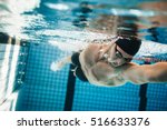 Fit swimmer training in the...
