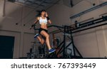 Small photo of Female athlete with motion capture sensors on her body running in biomechanical lab. Recording the movement and performance of sportswoman in sports science lab.