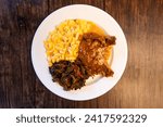 Small photo of Smothered Pork Chop with two sides