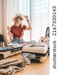 Small photo of Travel. Staycation.local travel new normal.Girl packing luggage in suitcase and travel documents Travel,tourism,vacation,relocation.Mental health and travel vacation Film grain