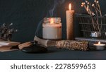 Small photo of Tarot, astrology,Esoteric, Occult mystical ritual scene of sorcery tarot candles,dried flowers, palo santo tarot cards, ritual book.Witchcraft,mysticism and occultism,esoteric background,tarot banner
