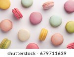 Macarons pattern on white background. Colorful french desserts. Top view