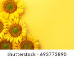 Sunflowers On A Yellow...