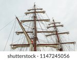 Small photo of The rigging of a square rigger against blue sky, foremast, mainmast and mizzen with sails, Hundested, Denmark, July 31, 2018