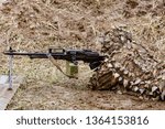 Small photo of Machine gunner in combat position