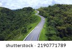 Small photo of The road is similar to the number 3, This road is built on a mountain, past the forest in Nan Province of Thailand.