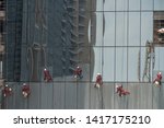 Group Of Workers Cleaning The...