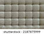 Gray suede leather background for the wall in the room. Interior design, headboards made of furniture fabric, furniture upholstery. Classic checkered pattern for furniture, wall, headboard