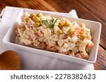 Small photo of Russian Salad, also known as Oliver Salad. Very popular dish in several countries, the main ingredients are commonly potatoes, mayonnaise and vegetables such as peas, carrots, boiled eggs or chicken.