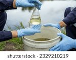 Small photo of Environmental researchers investigate the condition of canal water for toxic spills, river waste water sampling, Asian researchers collect water samples in farmland for research and development.