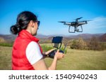 A Woman Is Piloting A Drone...