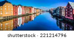Panoramic view from bridge to famous wooden colored houses in Trondheim city, Norway - architecture background