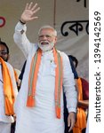 Small photo of Prime Minister Narendra Modi waves Bharatiya Janta Party supporters during an election campaign for Lok Sabha Election at Barrackpore constituency on April 29, 2019 in Barrackpore, India.