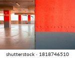 Small photo of Background of the underground parking. Red color lithoidal post