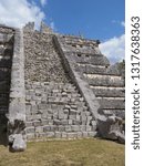 Small photo of Stony stairs of tomb of High Priest pyramid at Chichen Itza mayan town at impressive archaeological sites in Mexico, cloudy blue sky in 2018 warm sunny winter day, North America on February - vertical