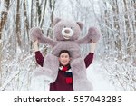 Man hold two big teddy bears soft toy as a present to his girlfriend for birthday party in the winter