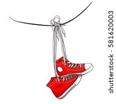 Red Sneakers Hanging On Wires
