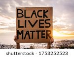 Black lives matter banner - Activist movement protesting against racism and fighting for equality - Social protests and human rights concept 