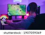 Small photo of Young gamer playing online video games while streaming on social media - Youth people addicted to new technology game