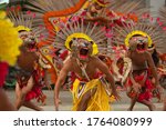 Small photo of Male dancers in very exotic jaguar animal costumes and headdresses perform in the colourful Boi Bumba folklore Festival in Parintins, Amazonas State, Brazil. 05-20-2019