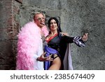 Small photo of Lucca, Tuscany, Italy - November 5, 2023: Cosplayers dressed as Boa Hancock from One Piece and Ken from Barbie. Lucca Comics and Games 2023.