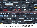Top view of numerous cars in a...