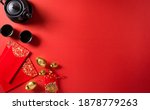 Small photo of Chinese new year festival decorations pow or red packet, orange and gold ingots or golden lump on a red background. Chinese characters FU in the article refer to fortune good luck, wealth, money flow.