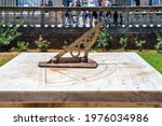 Small photo of Old sundial at the National Garden public park, at the center of Athens-Greece. Antique astronomical sun clock with rusty steel gnomon dial on marble. Entrance from Vasilisis Amalias avenue, Syntagma