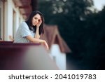 Small photo of Woman Suffering a Headache Taking Fresh Air on the Balcony Young person feeling groggy with a migraine suffering from sleep inertia