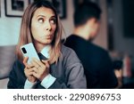 
Curious Girlfriend Spying on her partner Texting Other Women. Suspicious wife trying to check on her husband on a dating website
