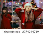 
Exasperated Mother Feeling Stressed During Christmas Holidays. Shocked mom feeling under pressure organizing Xmas party

