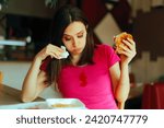 Small photo of Woman Eating Burger Staining Herself with ketchup. Clumsy restaurant customer dropping some tomato sauce on pink blouse