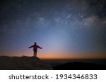 Small photo of Silhouette of young traveler and backpacker watched the star and milky way alone on top of the mountain. He enjoyed traveling and was successful when he reached the summit.
